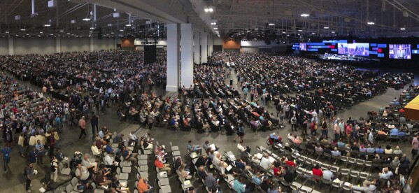 FILE - In this Wednesday, June 16, 2021, file photo, people attend the morning session of the Southern Baptist Convention annual meeting in Nashville, Tenn. Southern Baptists gathering at their next annual meeting June 11-12, 2024, in Indianapolis will vote on whether to enact a constitutional ban on churches with women pastors. (AP Photo/Mark Humphrey, File)