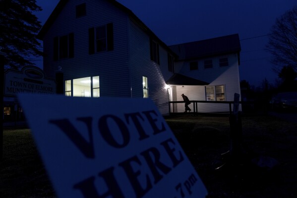 FILE - A voter enters a polling site for the presidential primary election at the town office, Tuesday evening, March 5, 2024, in Elmore, Vt. (AP Photo/David Goldman, File)