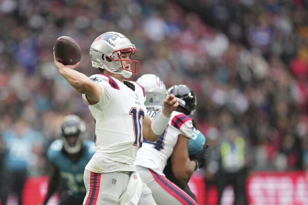 New England Patriots quarterback Drake Maye (10) throws during the first half of an NFL football game against the Jacksonville Jaguars, Sunday, Oct. 20, 2024, in London. (AP Photo/Kin Cheung)