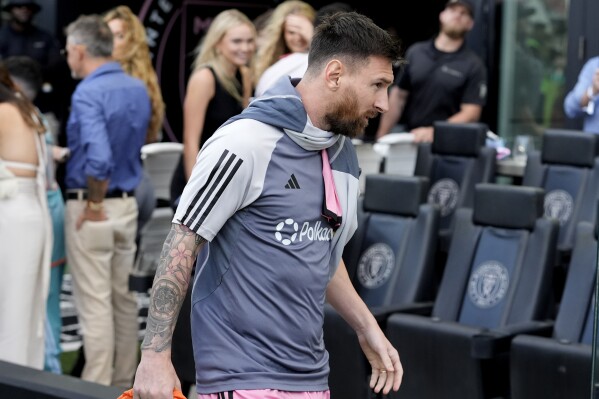 Inter Miami forward Lionel Messi walks onto the field before an MLS soccer match against the New England Revolution, Saturday, Oct. 19, 2024, in Fort Lauderdale, Fla. (AP Photo/Lynne Sladky)