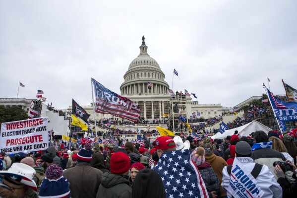 FILE - People attack the U.S. Capitol in Washington, on Jan. 6, 2021. (AP Photo/Jose Luis Magana, File)