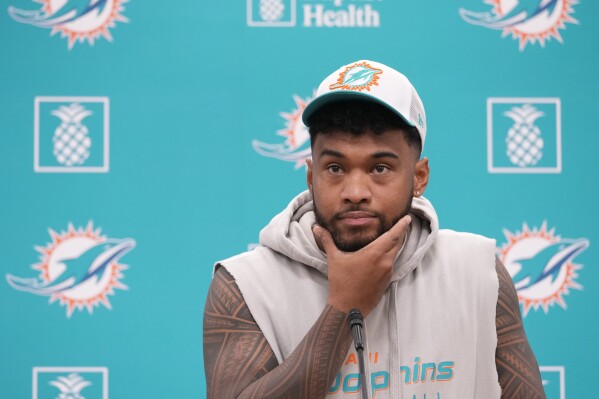 Miami Dolphins quarterback Tua Tagovailoa takes questions during a news conference, Monday, Oct. 21, 2024, at the Dolphins training facility in Miami Gardens, Fla. (AP Photo/Wilfredo Lee)