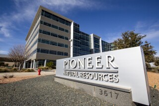 FILE - Pioneer Natural Resources Midland headquarters office is shown on Jan. 13, 2021, in Midland, Texas. Exxon Mobil’s $60 billion deal to buy Pioneer Natural Resources has received clearance from the Federal Trade Commission, but the former CEO of Pioneer was barred from joining the new company’s board of directors. The FTC said Thursday, May 2, 2024 that Scott Sheffield colluded with OPEC and OPEC+ to potentially raise crude oil prices. (Jacob Ford/Odessa American via AP, File)