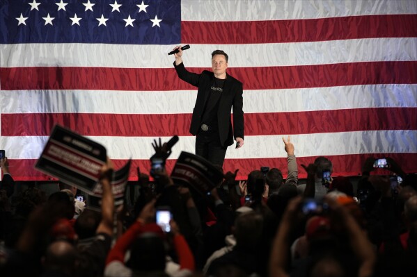 Elon Musk speaks as part of a campaign town hall in support of Republican presidential nominee former President Donald Trump in Folsom, Pa., Thursday, Oct. 17, 2024. (AP Photo/Matt Rourke)