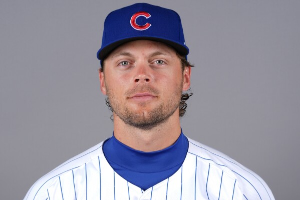 FILE - Nico Hoerner of the Chicago Cubs baseball team poses Feb. 20, 2024. (AP Photo/Matt York, File)