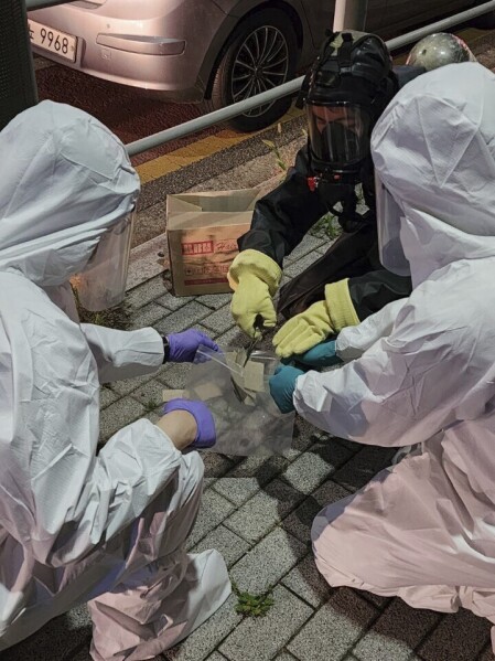 In this photo provided by South Korea Defense Ministry, South Korean soldiers wearing protective gears check the trash from a balloon presumably sent by North Korea, in Seoul, South Korea, Tuesday, June 25, 2024. South Korea threatened Tuesday to restart anti-Pyongyang frontline propaganda broadcasts in the latest bout of Cold War-style campaigns between the rivals after North Korea resumed its trash-carrying balloon launches. (South Korea Defense Ministry via AP)