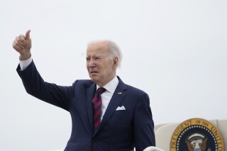 President Joe Biden gives a thumbs up before boarding Air Force One at Andrews Air Force Base, Md., Saturday, May 13, 2023, en route to Dover Air Force Base in Dover, Del. Biden is spending the weekend at his home in Rehoboth Beach, Del. (AP Photo/Carolyn Kaster)