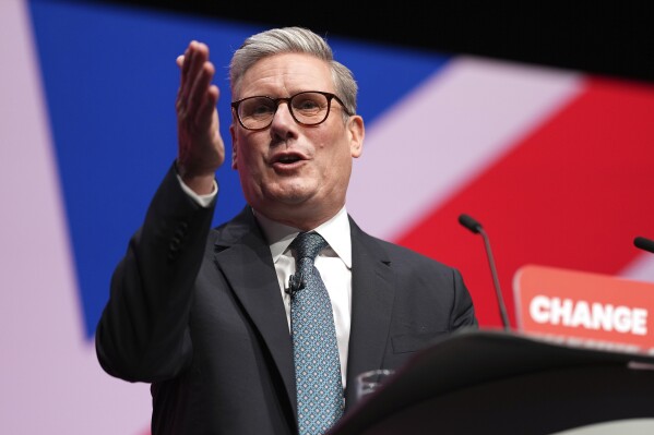 Britain's Prime Minister Keir Starmer addresses members at the Labour Party Conference in Liverpool, England, Tuesday, Sept. 24, 2024.(AP Photo/Jon Super)