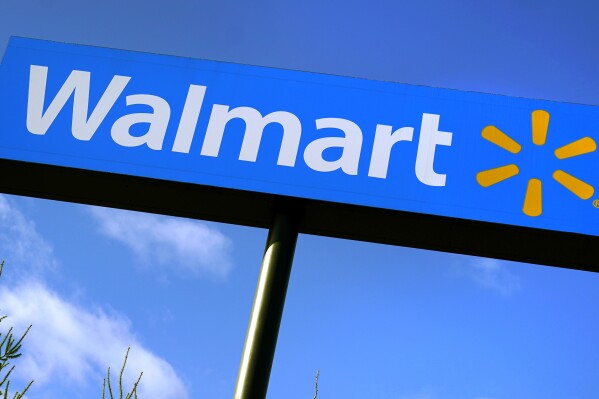 FILE - A Walmart store sign is visible from Route 28 Nov. 18, 2020, in Derry, N.H. (AP Photo/Charles Krupa, File)