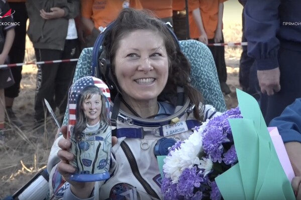 In this photo taken from video released by Roscosmos space corporation, the NASA astronaut Tracy Dyson holds a Russian traditional Matryoshka wooden doll depicting her shortly after the landing of the Russian Soyuz MS-25 space capsule carrying the NASA astronaut Tracy Dyson and the Roscosmos cosmonauts Oleg Kononenko and Nikolai Chub, south-east of the Kazakh town of Zhezkazgan, Kazakhstan, Monday, Sept. 23, 2024. (Roscosmos space corporation via AP)