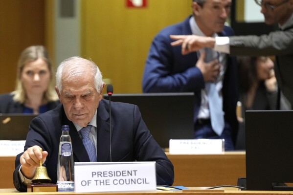 European Union foreign policy chief Josep Borrell rings a bell to signify the start of a meeting of EU foreign ministers at the European Council building in Brussels, Monday, Feb. 19, 2024. European Union foreign ministers on Monday will discuss, among other issues, the situation in the Middle East and Russian aggression against Ukraine. (AP Photo/Virginia Mayo)