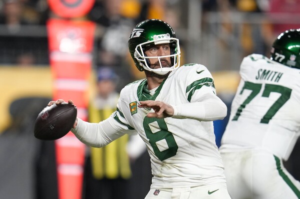 New York Jets quarterback Aaron Rodgers (8) passes in the first half of an NFL football game in Pittsburgh, Sunday, Oct. 20, 2024. (AP Photo/Gene J. Puskar)