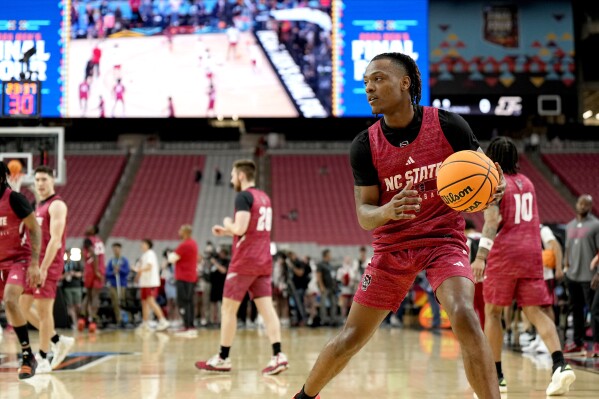 NC State guard DJ Horne practices ahead of a Final Four college basketball game in the NCAA Tournament, Friday, April 5, 2024, in Glendale, Ariz. North Carolina State plays Purdue. (AP Photo/Brynn Anderson )