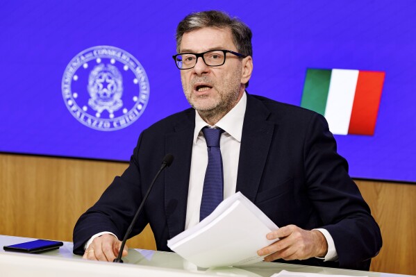 Economy minister Giancarlo Giorgetti holds a press conference on the approved Budget Bill in Rome, Wednesday, Oct. 16, 2024. (Roberto Monaldo/LaPresse via AP)