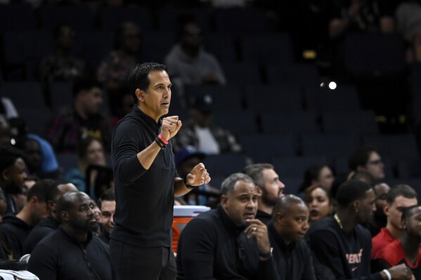 Miami Heat head coach Erik Spoelstra looks on during the second half of an NBA preseason basketball game against the Charlotte Hornets, Tuesday, Oct. 8, 2024, in Charlotte, N.C. (AP Photo/Matt Kelley)