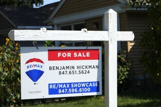 A "For Sale" sign is displayed in front of a home in Morton Grove, Ill., Sunday, August. 25, 2024. (AP Photo/Nam Y. Huh)