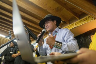 FILE - Buu Nygren announces his win for the Navajo Nation president as he reads tabulated votes from chapter houses across the reservation at his campaign's watch party at the Navajo Nation fairgrounds in Window Rock, Ariz., on Tuesday, Nov. 8, 2022. (AP Photo/William C. Weaver IV, File)