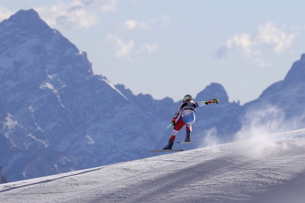 FILE - Switzerland's Priska Nufer speeds down the course during an alpine ski, women's World Cup downhill training, in Cortina d'Ampezzo, Italy, Jan. 21, 2022. (AP Photo/Alessandro Trovati, File)