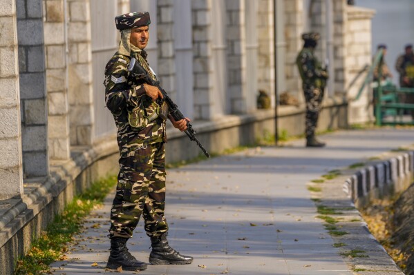 Paramilitary soldiers stand guard outside the venue of swearing in ceremony of ministers of Kashmir's local government on the outskirts of Srinagar, Indian controlled Kashmir, Wednesday, Oct. 16, 2024. (AP Photo/Dar Yasin)