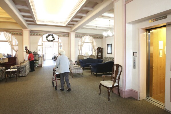 FILE - Bret Harte Retirement Inn residents make their way down to the dining room for lunch, May 6, 2020, in Grass Valley, Calif. The federal government will, for the first time, dictate staffing levels at nursing homes, the Biden administration said Friday, Sept. 1, 2023, responding to systemic problems bared by mass COVID deaths. (Elias Funez/The Union via AP, File)