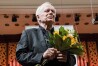 Polish pianist Janusz Olejniczak, who played the piano parts in the 2002 Oscar-winning movie "The Pianist," receives applause from the audience following a concert at the Warsaw Philharmonic on Jan. 5, 2020. Olejniczak died from heart attack on Sunday, Oct. 20, 2024. (AP Photo/Wojciech Grzedzinski )