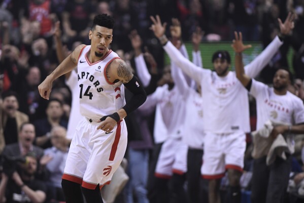 FILE - Toronto Raptors guard Danny Green (14) reacts after making a 3-pointer against the Golden State Warriors during the first half of Game 1 of basketball's NBA Finals, May 30, 2019, in Toronto. (Frank Gunn/The Canadian Press via AP, File)