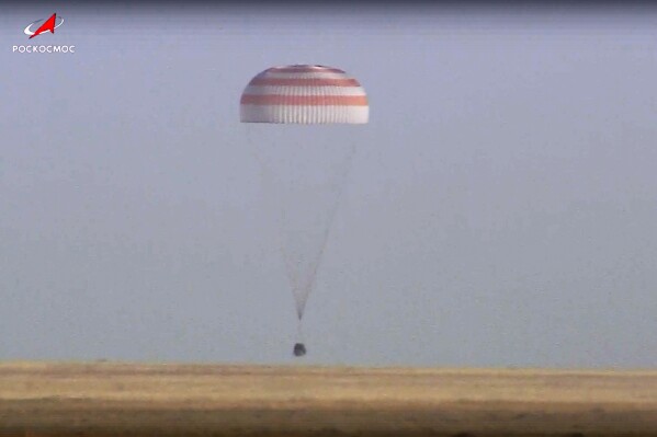 In this photo taken from video released by Roscosmos space corporation, Russian Soyuz MS-25 space capsule carrying the NASA astronaut Tracy Dyson and the Roscosmos cosmonauts Oleg Kononenko and Nikolai Chub lands south-east of the Kazakh town of Zhezkazgan, Kazakhstan, Monday, Sept. 23, 2024. (Roscosmos space corporation via AP)