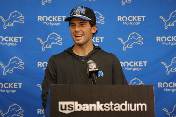 Detroit Lions place kicker Jake Bates speaks to the media after an NFL football game against the Minnesota Vikings, Sunday, Oct. 20, 2024, in Minneapolis. (AP Photo/Bruce Kluckhohn)