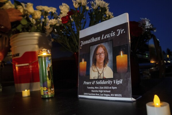 FILE - A memorial for Jonathan Lewis Jr. is set up in an alleyway near Rancho High School in eastern Las Vegas, Nov. 21, 2023. (AP Photo/Ty O'Neil, File)