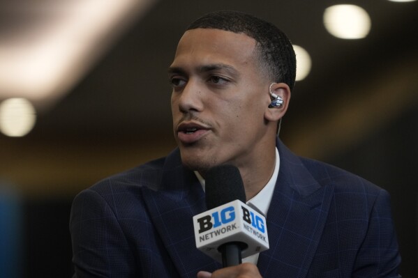 UCLA's Kobe Johnson speaks during the Big Ten men's NCAA college basketball media day Thursday, Oct. 3, 2024, in Rosemont, Ill. (AP Photo/Erin Hooley)