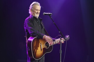 FILE - Artist and songwriter Kris Kristofferson performs "Sunday Morning Coming Down" at the Nashville Songwriters Association International "50 Years of Songs" at the Ryman Auditorium, Sept. 20, 2017, in Nashville, Tenn. (Photo by Laura Roberts/Invision/AP, File)