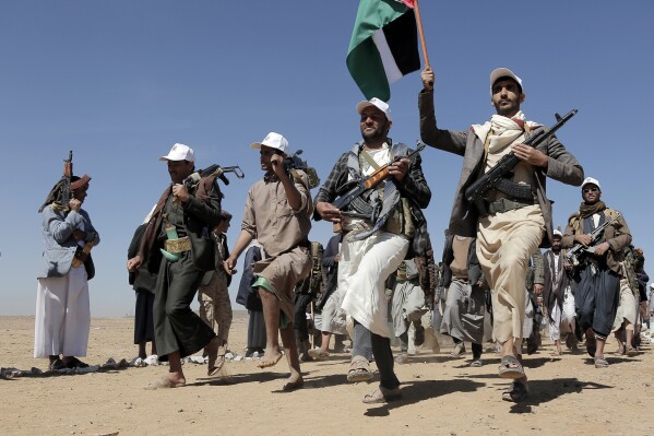 File - Houthi rebel fighters march during a rally of support for the Palestinians in the Gaza Strip and against the U.S. strikes on Yemen outside Sanaa on Jan. 22, 2024. (AP Photo, File)