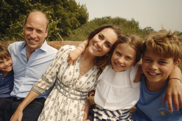 This photo provided by Kensington Palace on Monday, Sept. 9, 2024, shows Kate, Princess of Wales and Prince William with their children Prince George, right, Princess Charlotte and Prince Louis, left. (Will Warr/Kensington Palace via AP)