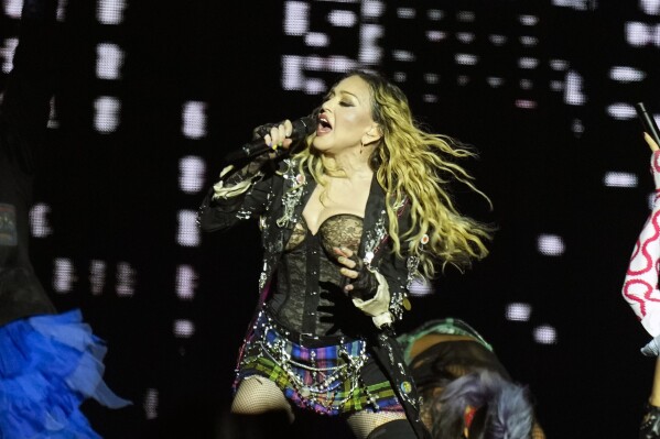 FILE - Madonna performs in the final show of her The Celebration Tour, on Copacabana Beach in Rio de Janeiro, Brazil, on May 4, 2024. Madonna will celebrate her 66th birthday with a private evening tour of the famed Italian archaeological site at Pompeii, officials said. (AP Photo/Silvia Izquierdo, File)