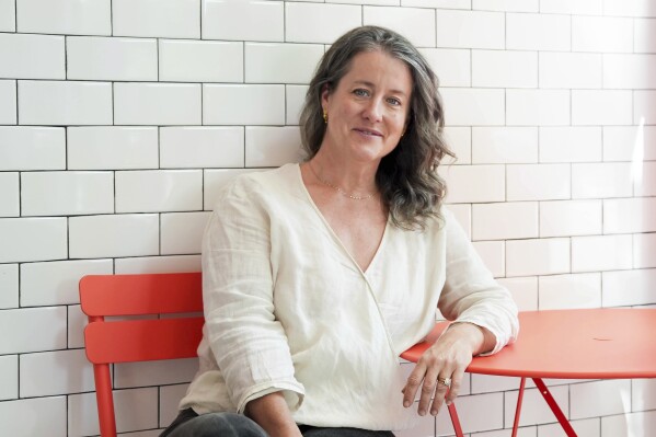 Naomi Pomeroy sits inside Cornet Custard, on Sunday, June 30, 2024, in Portland, Ore. Pomeroy, an award-winning chef who helped put Portland, Ore., on the map as a culinary destination, has drowned in an inner tubing accident in the Willamette River, authorities said. She was 49 years old. Pomeroy drowned Saturday, July 13, 2024, near Corvallis after the group she was tubing with got caught on an exposed snag in the water, the Benton County Sheriff's Office said. (Vickie Connor/The Oregonian via AP)