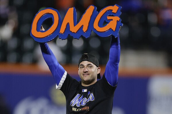 New York Mets second baseman Jose Iglesias celebrates on the field after the Mets beat the Philadelphia Phillies in Game 4 of the National League baseball playoff series, Wednesday, Oct. 9, 2024, in New York. (AP Photo/Adam Hunger)