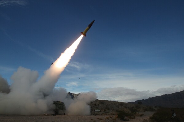 FILE - In this image provided by the U.S. Army, soldiers, from the 3rd Battalion, 321st Field Artillery Regiment of the 18th Field Artillery Brigade out of Fort Bragg N.C., conduct live fire testing at White Sands Missile Range, N.M., on Dec. 14, 2021, of early versions of the Army Tactical Missile System. (John Hamilton/U.S. Army via AP, File)