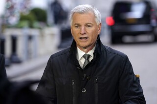 FILE - Robert Jordan, incoming Southwest Airlines CEO, is interviewed outside the New York Stock Exchange, Dec. 9, 2021. The CEO of Southwest Airlines said Wednesday, June 12, 2024, that he will not resign in the face of pressure from a hedge fund that wants him fired and that his leadership team will produce its own plan to boost the airline's financial performance. (AP Photo/Richard Drew, File)