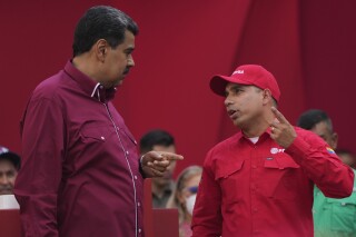 FILE - Venezuelan President Nicolás Maduro, left, speaks with Pedro Tellechea, the oil minister and president of the Venezuelan state oil company PDVSA, during a May Day event in Caracas, Venezuela, May 1, 2023. (AP Photo/Ariana Cubillos, File)