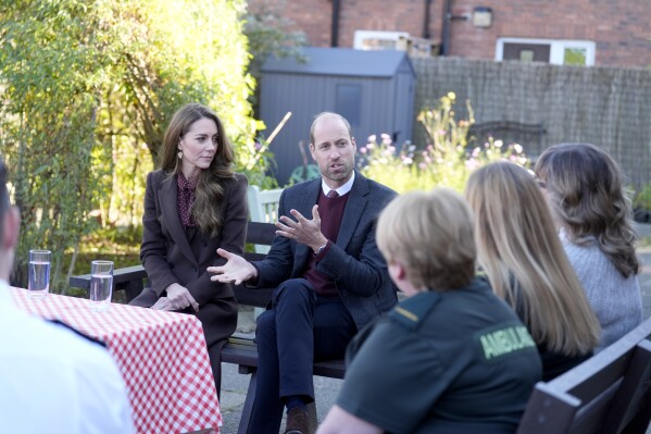 Britain's Prince William and Kate, Princess of Wales, speak to members of the emergency services during a visit to Southport Community Centre to meet rescue workers and the families of those caught up in the Southport knife attack earlier this year, in Southport, England, Thursday, Oct. 10, 2024. (Danny Lawson, Pool Photo via AP)