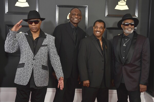 FILE - In this Feb. 12, 2017 file photo Dennis D.T. Thomas, from left, George Brown, Robert Bell, and Ronald Bell, of the musical group Kool & The Gang, arrive at the 59th annual Grammy Awards at the Staples Center, in Los Angeles. (Photo by Jordan Strauss/Invision/AP, File)