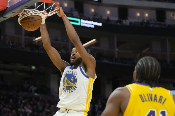 Golden State Warriors guard Moses Moody dunks against the Los Angeles Lakers during the second half of an NBA preseason basketball game in San Francisco, Friday, Oct. 18, 2024. (AP Photo/Jeff Chiu)