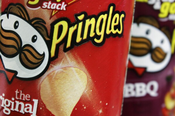 FILE - In this April 5, 2011 file photo, Pringles chips are seen in a posed photo at a West Bath, Maine grocery store. (AP Photo/Pat Wellenbach, File)