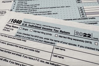 FILE - The Internal Revenue Service 1040 tax form for 2022 is seen on April 17, 2023. (AP Photo/Jon Elswick, File)