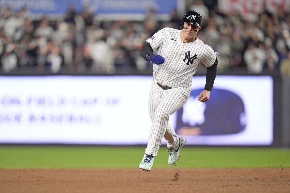 New York Yankees' Anthony Rizzo runs toward third base during the second inning in Game 1 of the baseball AL Championship Series against the Cleveland Guardians Monday, Oct. 14, 2024, in New York. (AP Photo/Frank Franklin II)