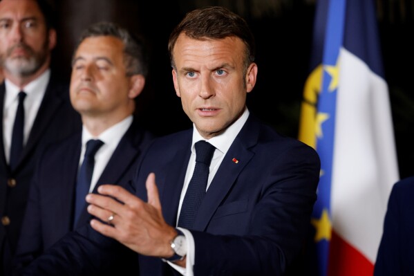 French President Emmanuel Macron delivers a speech at New Caledonia's High Commissioner residency, in Noumea, France's Pacific territory of New Caledonia Thursday May, 23, 2024. French President Emmanuel Macron pushed Thursday on a visit to riot-hit New Caledonia for the removal of protesters' barricades and said police sent in to help battle deadly unrest in the French Pacific archipelago "will stay as long as necessary," even as security services back in France focus in coming weeks on safeguarding the Paris Olympics. (Ludovic Marin, Pool via AP)