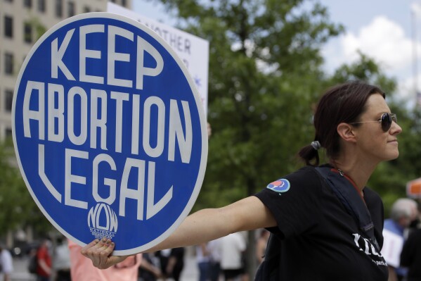 FILE - An. Abortion rights demonstrator holds a sign during a rally on May 14, 2022, in Chattanooga, Tenn. (AP Photo/Ben Margot, File)