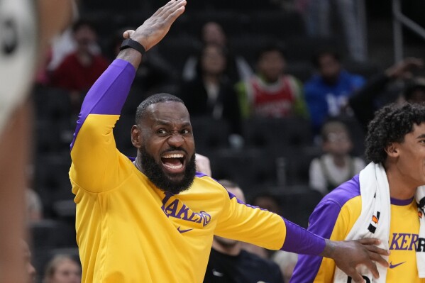 Los Angeles Lakers' LeBron James reacts during the second half of an NBA preseason basketball game against the Milwaukee Bucks Thursday, Oct. 10, 2024, in Milwaukee. (AP Photo/Morry Gash)