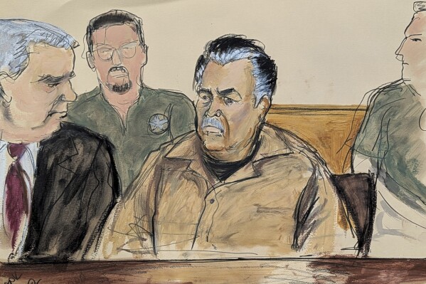 FILE - In this courtroom sketch, Ismael “El Mayo” Zambada, center, is seated beside his defense attorney Frank Perez, left, in federal court in the Brooklyn borough of New York, Sept. 13, 2024. (Elizabeth Williams via AP, File)