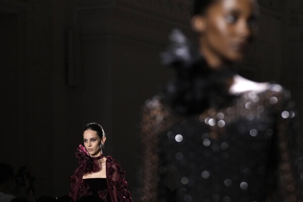 Models wear creations for the Elie Saab Haute Couture Fall-Winter 2024-2025 collection presented Wednesday, June 26, 2024 in Paris. (AP Photo/Christophe Ena)